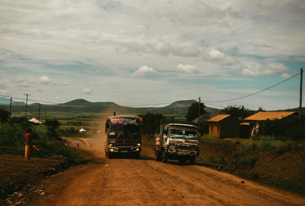 two trucks on dirt