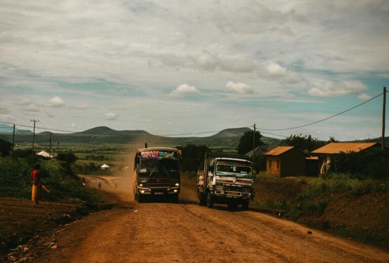 two trucks on dirt