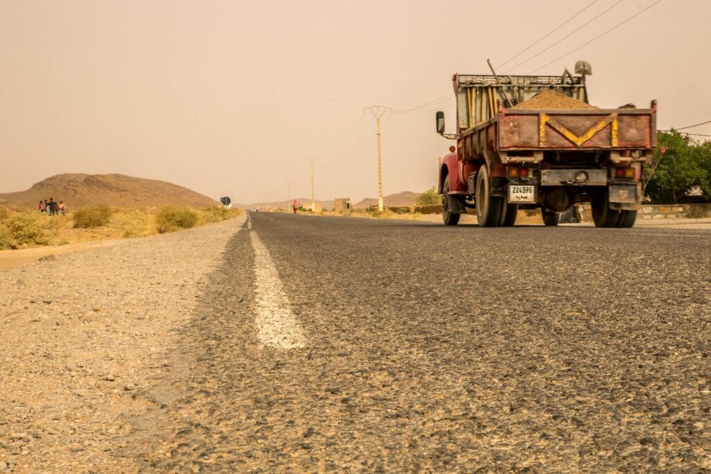 Heavy freight truck on the Trans-Kalahari corridor through Namibia toward Walvis Bay port