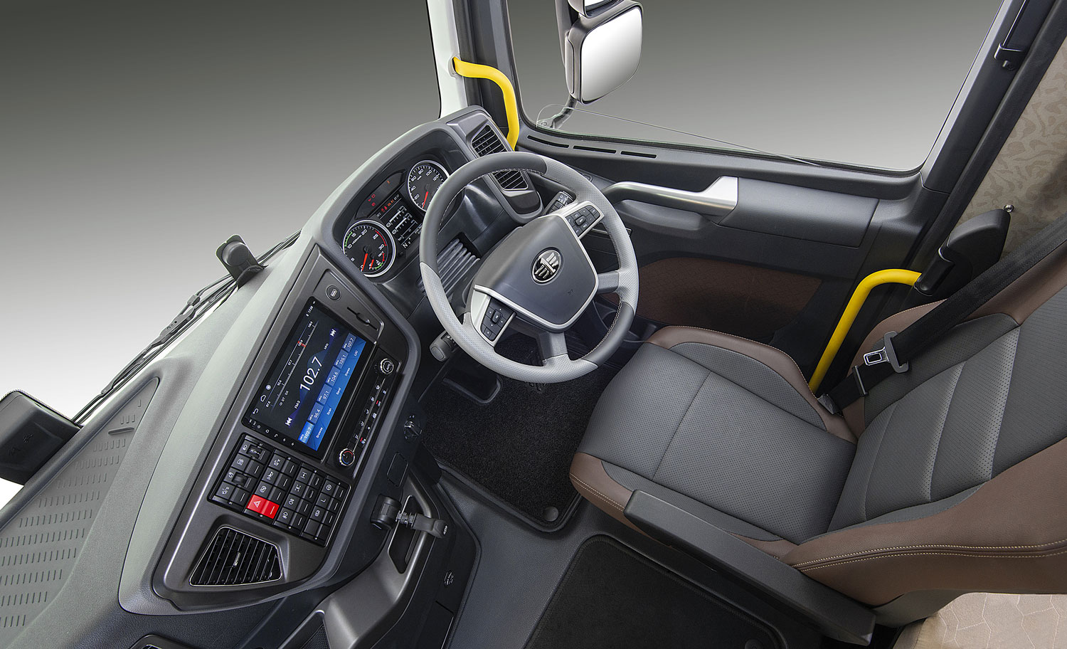 Interior of a FAW J7 flagship truck tractor cab, right-hand drive